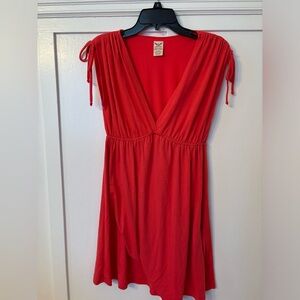Women’s red/coral knee length dress.